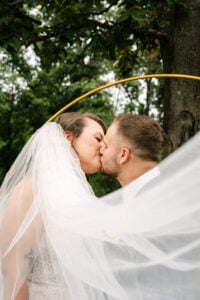 Wedding ceremony photography in Winston-Salem NC with bride and groom kissing